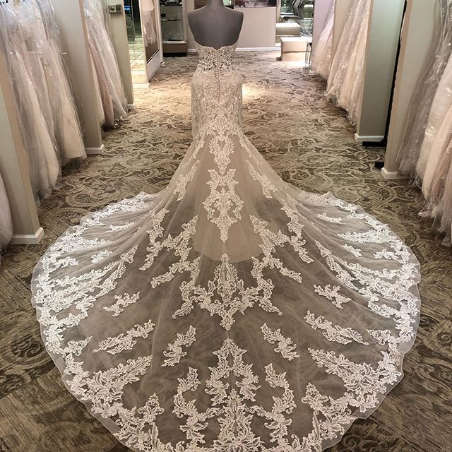 Long train from white wedding dress at J & B Bridals and Tuxedos